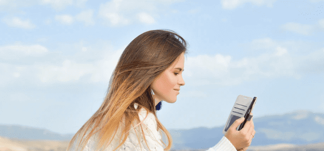 Woman reading her sweet good morning text messages.