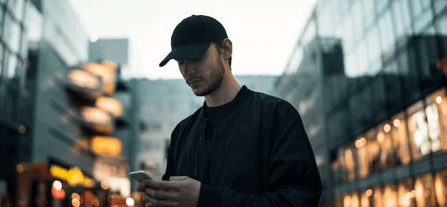 Man reading its phone text messages.